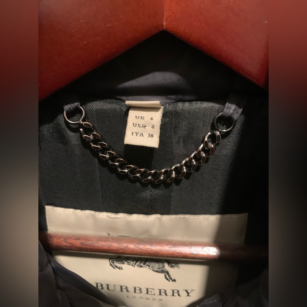 Size 4 Burberry jacket. Off centered zip/collars with beautiful details